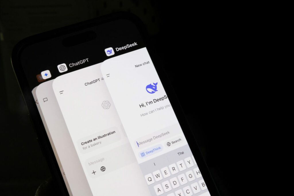 A smartphone with both DeepSeek and ChatGPT to depict DeepSeek vs ChatGPT.